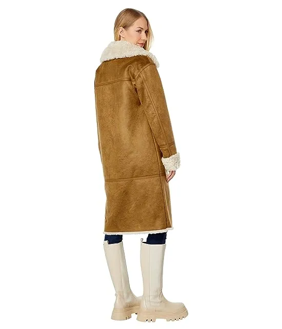 https://images.styletyx.com/images/shearling-bonded-to-suede-coat-nvlt-3039942_2.webp