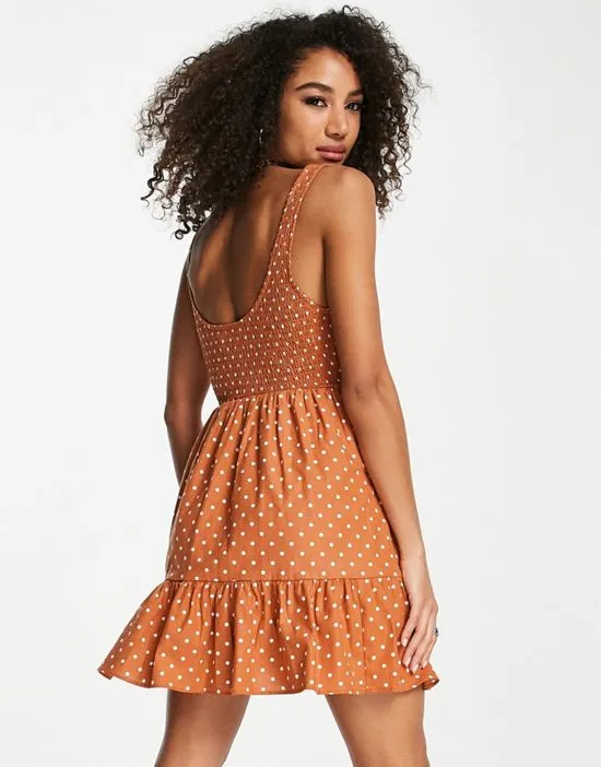 https://images.styletyx.com/images/shirred-mini-sundress-with-tiers-in-rust-spot-print-asos-design-2706821_2.webp