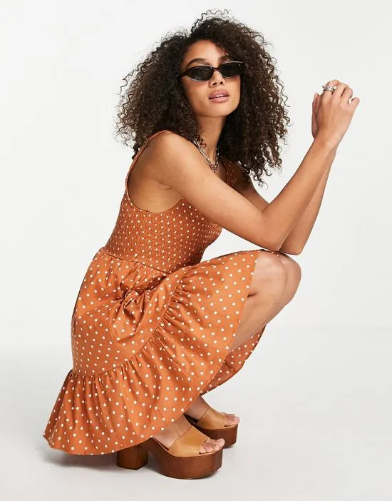 https://images.styletyx.com/images/shirred-mini-sundress-with-tiers-in-rust-spot-print-asos-design-2706821_4.webp