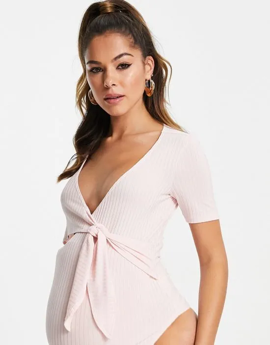 https://images.styletyx.com/images/short-sleeve-ballet-wrap-ribbed-bodysuit-in-light-pink-flounce-london-maternity-13293490_3.webp