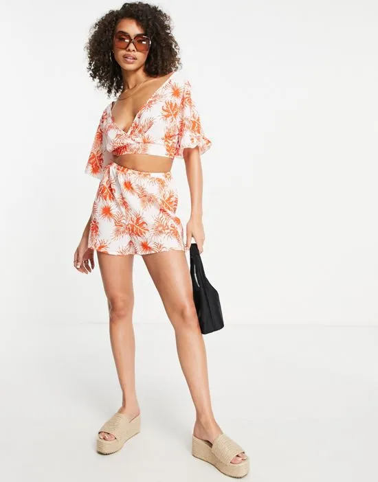https://images.styletyx.com/images/shorts-in-orange-tropical-floral-part-of-a-set-parisian-2491373_1.webp