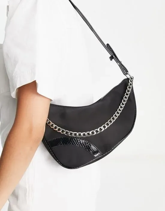 https://images.styletyx.com/images/shoulder-bag-in-black-nylon-with-patent-trim-and-silver-chain-skinnydip-13140006_1.webp