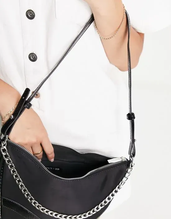 https://images.styletyx.com/images/shoulder-bag-in-black-nylon-with-patent-trim-and-silver-chain-skinnydip-13140006_4.webp