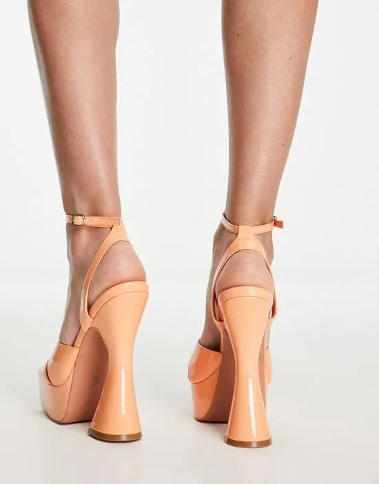 https://images.styletyx.com/images/simmi-london-oceani-platforms-with-flared-heel-in-apricot-patent-simmi-shoes-430299691_3.webp