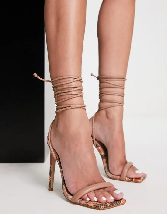 https://images.styletyx.com/images/simmi-london-samia-tie-ankle-snake-print-sandals-in-brown-simmi-shoes-2132839_4.webp