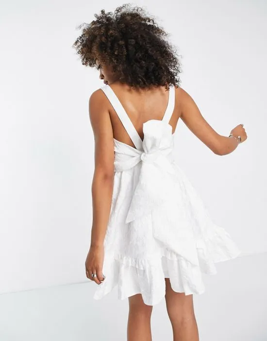 https://images.styletyx.com/images/sister-jane-mini-cami-dress-with-bow-back-in-white-jacquard-sister-jane-1837429_2.webp