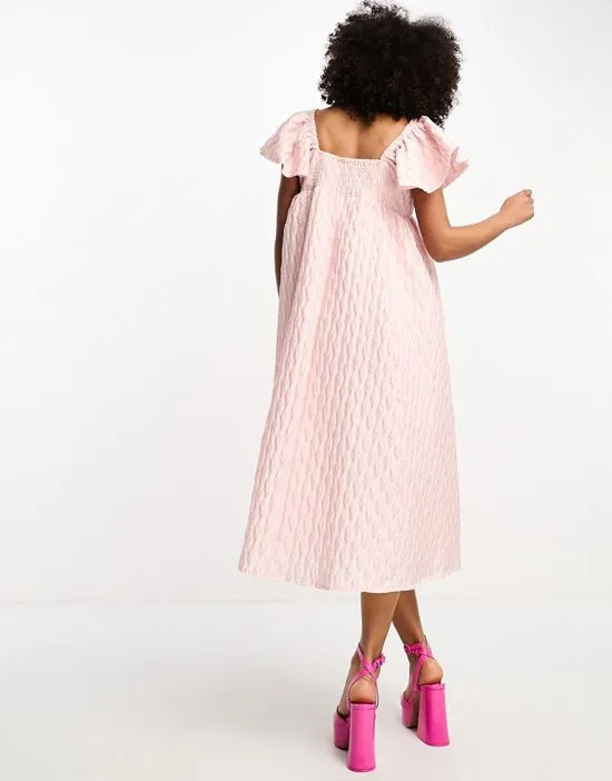 https://images.styletyx.com/images/sister-jane-puff-sleeve-jacquard-midi-dress-in-powder-pink-sister-jane-1221806120_3.webp