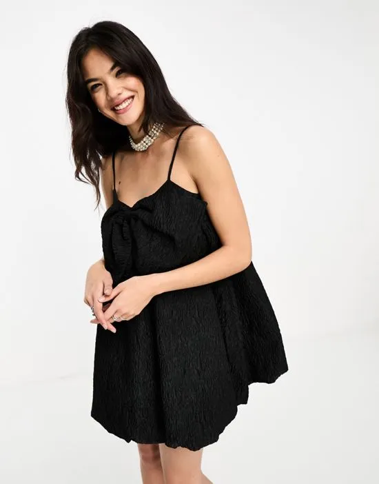 https://images.styletyx.com/images/sister-jane-puffball-bow-jacquard-mini-dress-in-black-sister-jane-1876563634_4.webp