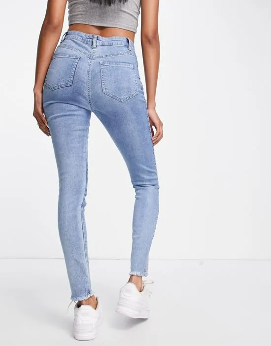 https://images.styletyx.com/images/skinny-jeans-with-panel-detail-in-mid-wash-blue-parisian-1965004_2.webp