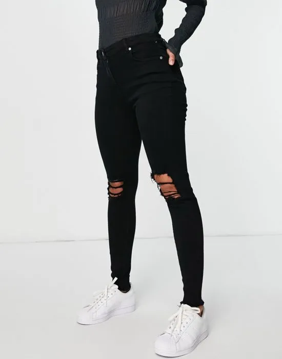 https://images.styletyx.com/images/skinny-jeans-with-ripped-knee-in-black-parisian-1963391_1.webp