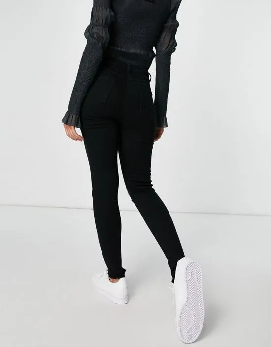 https://images.styletyx.com/images/skinny-jeans-with-ripped-knee-in-black-parisian-1963391_2.webp