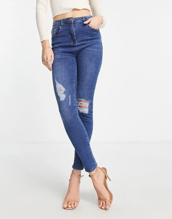 https://images.styletyx.com/images/skinny-jeans-with-rips-in-mid-wash-blue-parisian-tall-13285861_2.webp