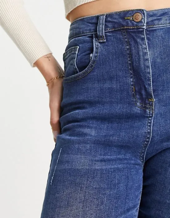 https://images.styletyx.com/images/skinny-jeans-with-rips-in-mid-wash-blue-parisian-tall-13285861_4.webp