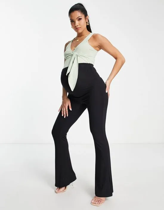 https://images.styletyx.com/images/sleeveless-ballet-wrap-ribbed-bodysuit-in-pastel-green-flounce-london-maternity-2712559_4.webp