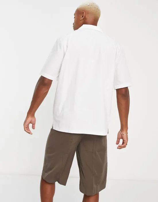 https://images.styletyx.com/images/slinky-cotton-short-sleeve-camp-collar-shirt-in-white-bando-1895824_2.webp