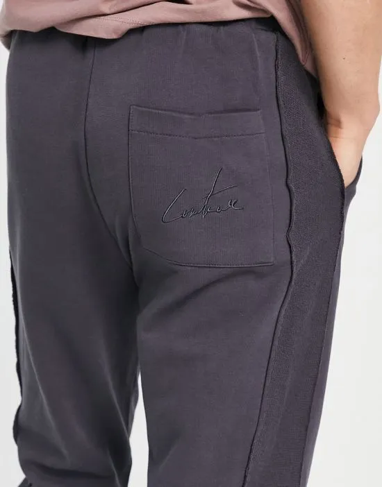https://images.styletyx.com/images/spliced-sweatpants-in-charcoal-with-gothic-detailing-part-of-a-set-the-couture-club-13004947_3.webp