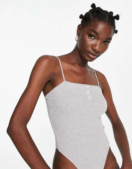https://images.styletyx.com/images/strappy-bodysuit-in-rib-button-detail-in-gray-heather-asos-design-1883418_4.webp