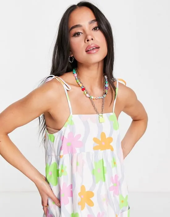 https://images.styletyx.com/images/strappy-cami-smock-dress-with-pockets-in-wavy-floral-native-youth-2695322_3.webp