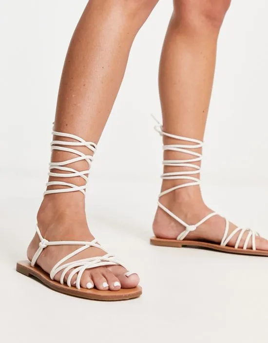 https://images.styletyx.com/images/strappy-tie-leg-flat-sandals-in-white-london-rebel-wide-fit-13315905_4.webp