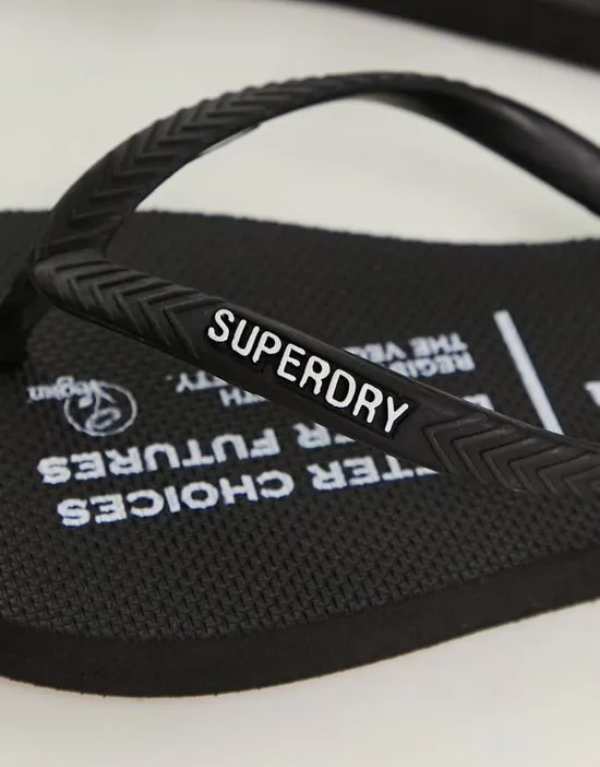 https://images.styletyx.com/images/studios-vegan-flip-flops-in-black-superdry-1321478988_3.webp