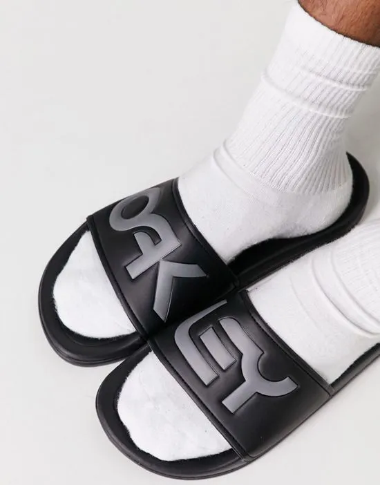 https://images.styletyx.com/images/summerville-slides-in-black-oakley-13693518_3.webp