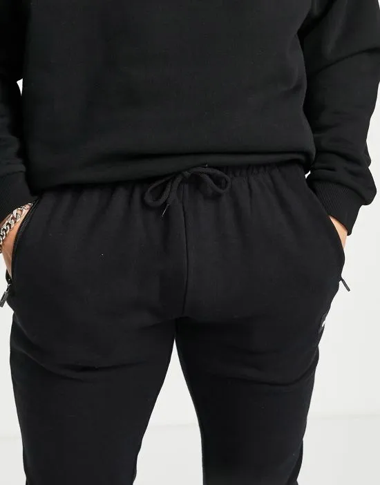 https://images.styletyx.com/images/sweatpants-with-taping-in-black-exclusive-to-asos-ellesse-13693322_3.webp