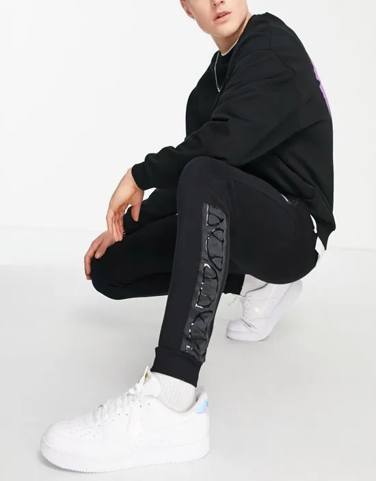 https://images.styletyx.com/images/sweatpants-with-taping-in-black-exclusive-to-asos-ellesse-13693322_4.webp