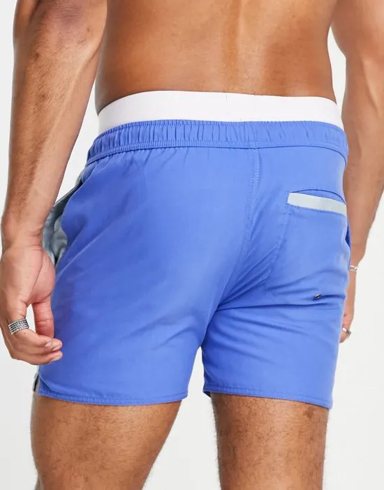 https://images.styletyx.com/images/swim-shorts-in-blue-color-block-native-youth-1887122_3.webp