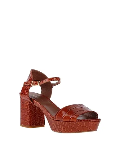 https://images.styletyx.com/images/tan-leather-sandals-liviana-conti-13101976_2.webp