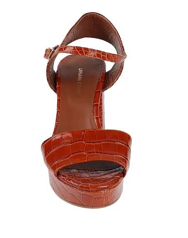 https://images.styletyx.com/images/tan-leather-sandals-liviana-conti-13101976_4.webp
