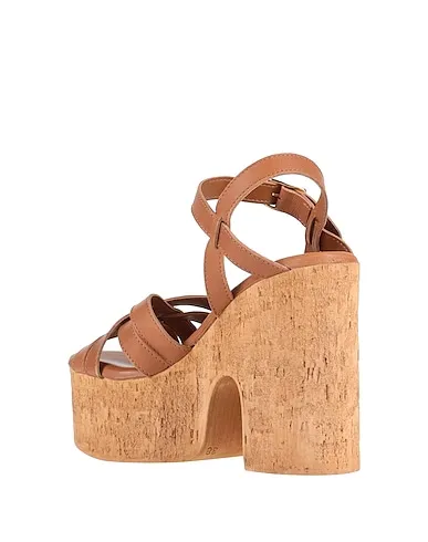 https://images.styletyx.com/images/tan-leather-sandals-nila-nila-822873_3.webp