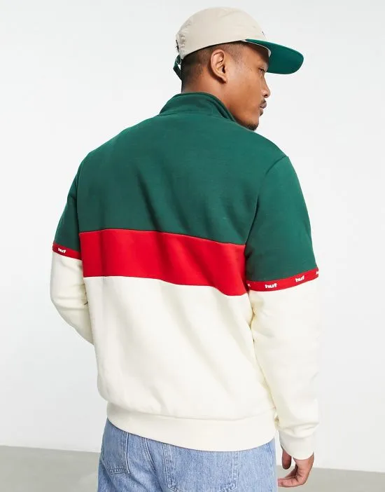 https://images.styletyx.com/images/taped-1-4-zip-sweatshirt-in-off-white-and-green-huf-3076770_3.webp