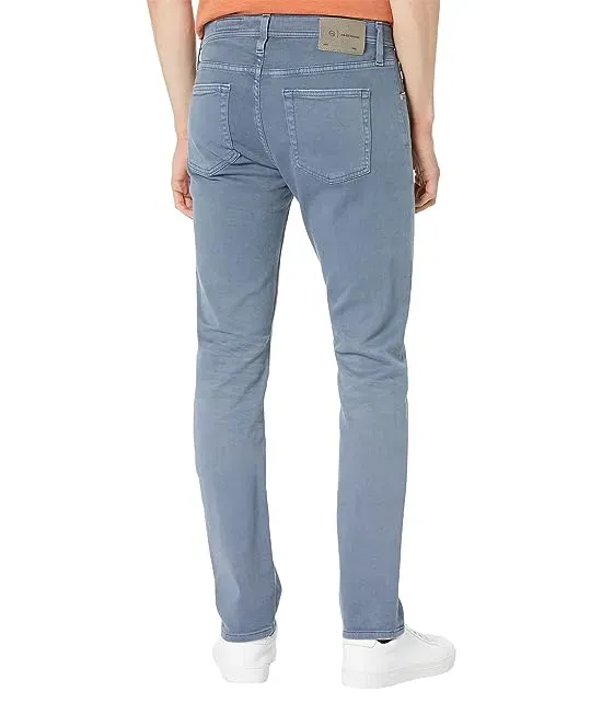 https://images.styletyx.com/images/tellis-slim-in-7-years-sulfur-bohemian-blue-ag-jeans-2574775_2.webp