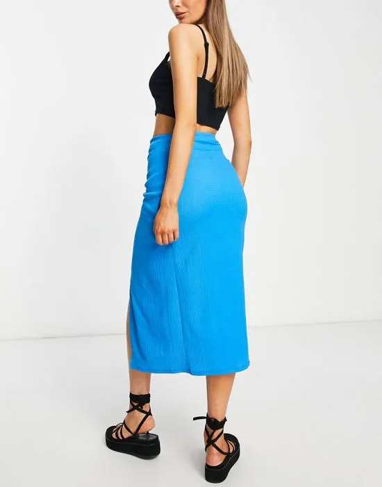 https://images.styletyx.com/images/textured-knot-wrap-midi-skirt-in-blue-stradivarius-2031671_2.webp