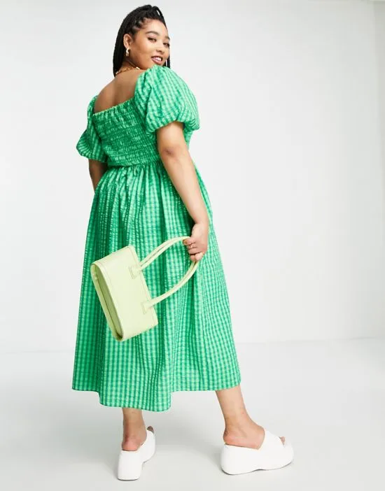 https://images.styletyx.com/images/textured-smock-midi-dress-in-green-gingham-never-fully-dressed-plus-2869576_2.webp