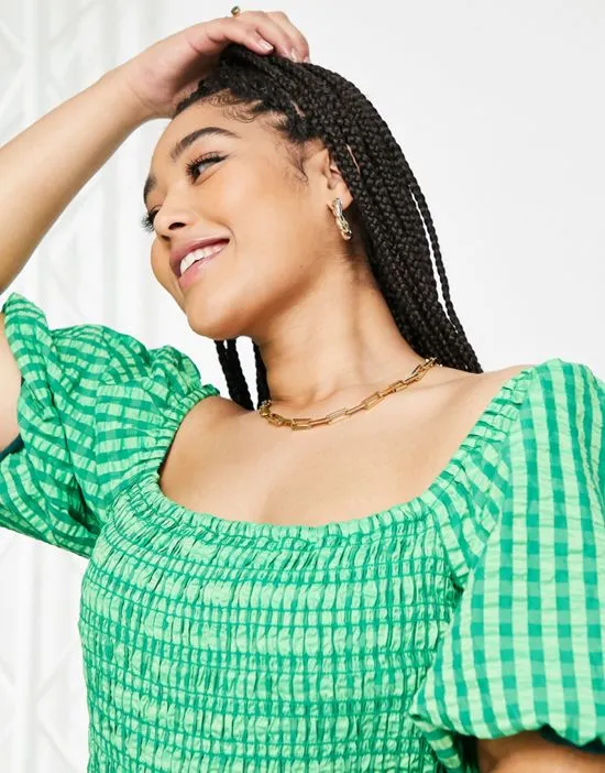 https://images.styletyx.com/images/textured-smock-midi-dress-in-green-gingham-never-fully-dressed-plus-2869576_3.webp
