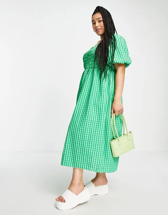 https://images.styletyx.com/images/textured-smock-midi-dress-in-green-gingham-never-fully-dressed-plus-2869576_4.webp