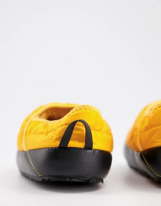 https://images.styletyx.com/images/thermoball-traction-slippers-in-yellow-the-north-face-1794630_4.webp