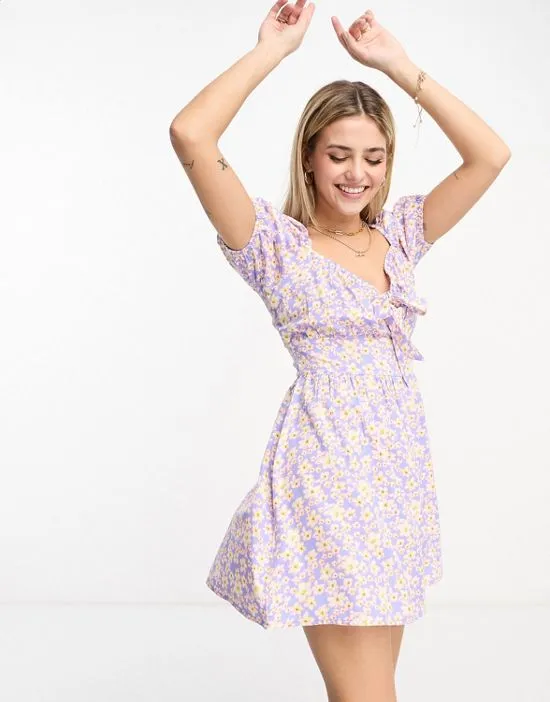 https://images.styletyx.com/images/tie-front-mini-tea-dress-in-purple-floral-wednesday-s-girl-13316198_4.webp