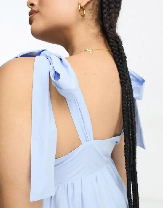 https://images.styletyx.com/images/tiered-midi-dress-with-tie-straps-in-blue-poplin-the-frolic-plus-13293080_2.webp