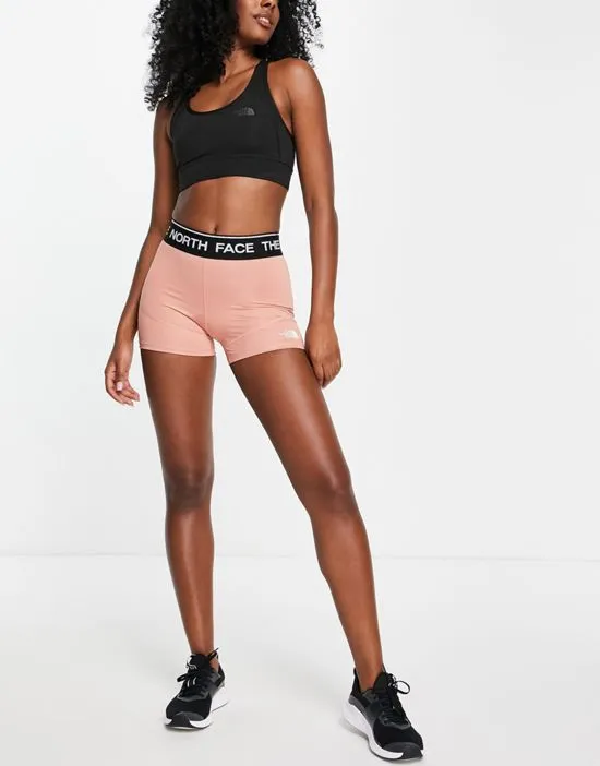 https://images.styletyx.com/images/training-logo-shorts-in-pink-the-north-face-2481665_4.webp