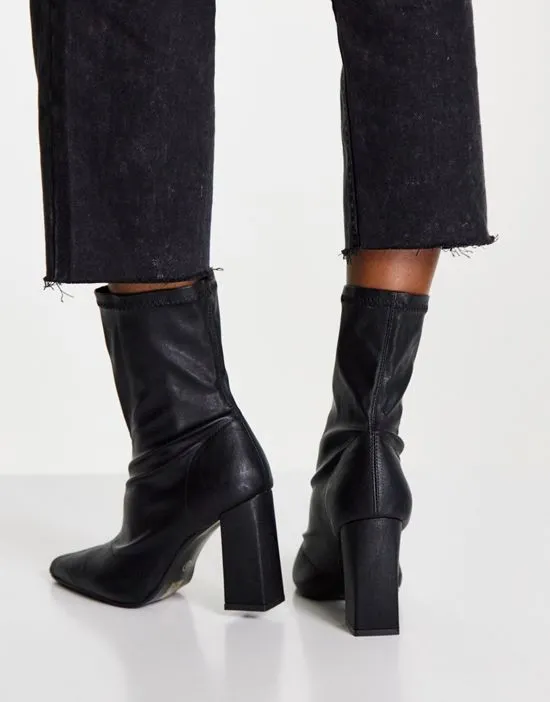 https://images.styletyx.com/images/truffle-collection-wide-fit-heeled-sock-boots-in-black-truffle-collection-wide-fit-2787363_3.webp