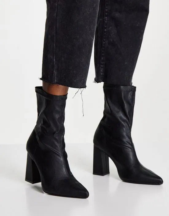 https://images.styletyx.com/images/truffle-collection-wide-fit-heeled-sock-boots-in-black-truffle-collection-wide-fit-2787363_4.webp