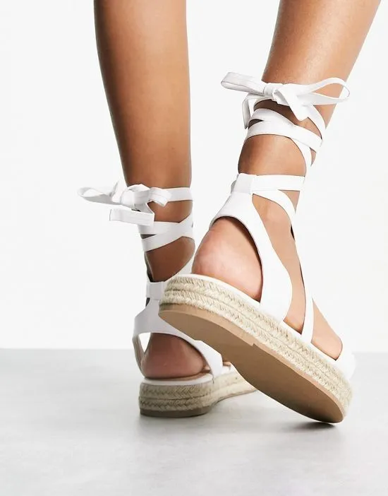 https://images.styletyx.com/images/truffle-collection-wide-fit-tie-leg-espadrille-sandals-in-white-truffle-collection-wide-fit-13040346_2.webp