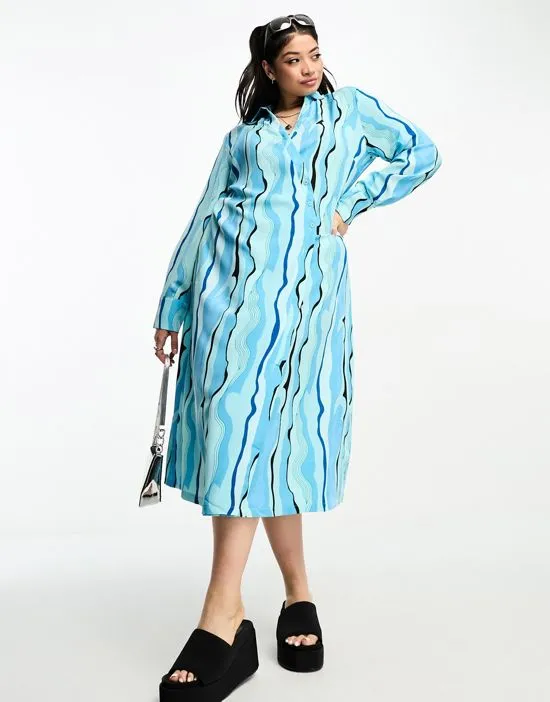 https://images.styletyx.com/images/urban-threads-plus-wrap-shirt-dress-in-blue-abstract-print-urban-threads-curve-1003583196_3.webp