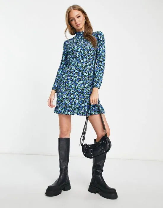 https://images.styletyx.com/images/vanessa-frill-neck-mini-dress-in-blue-and-green-floral-nobody-s-child-4628092_3.webp