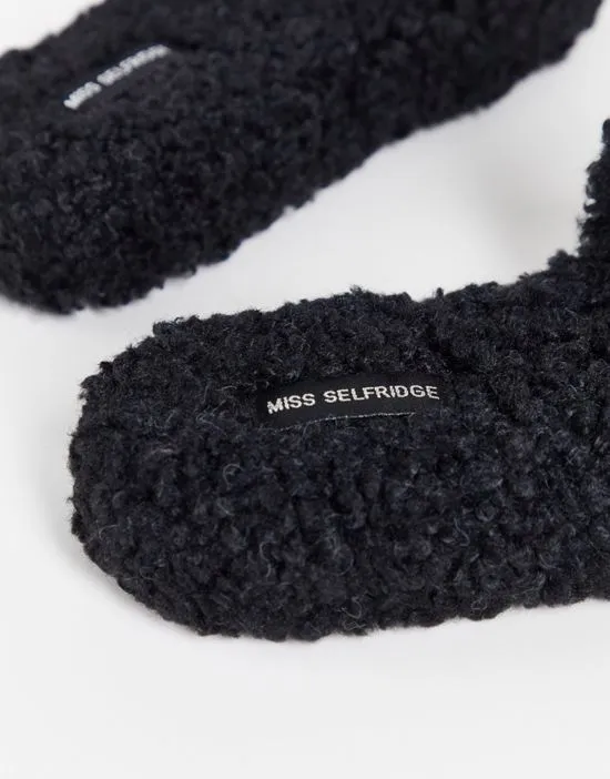 https://images.styletyx.com/images/victory-black-borg-slippers-miss-selfridge-3047930_2.webp