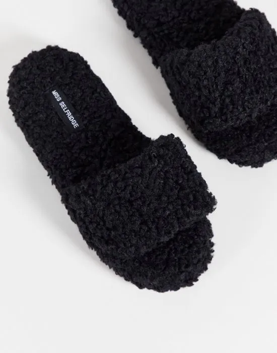 https://images.styletyx.com/images/victory-black-borg-slippers-miss-selfridge-3047930_3.webp