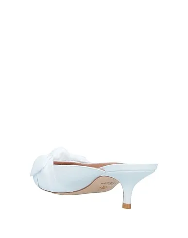 https://images.styletyx.com/images/white-leather-mules-and-clogs-stuart-weitzman-1467423_3.webp