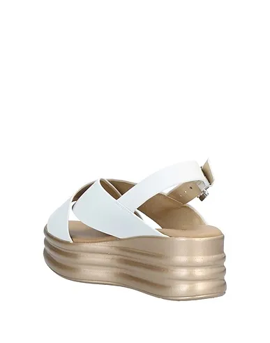 https://images.styletyx.com/images/white-leather-sandals-phil-gatier-by-repo-1322515_3.webp